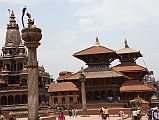 Kathmandu Patan Durbar Square 10 Krishna Mandir, King Yoganarendra Malla Column, Garuda Column, Vishwanath Temple, And Bhimsen Temple The Krishna Mandir temple, King Yoganarendra Malla column, Garuda column, Vishwanath Temple, and Bhimsen Temple occupy the west side of Patans Durbar Square. Vishwanath (Shiva) Temple (1627) is an elaborately decorated two-roofed temple with two stone elephants guarding the entrance. The Bhimsen Temple (1682) at the northern end of Durbar Square is a three-story temple dedicated to the god of trade and business.